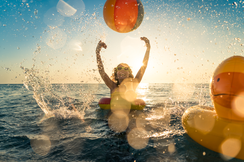 Kid Playing in The Ocean