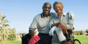 Elderly couple enjoying golf