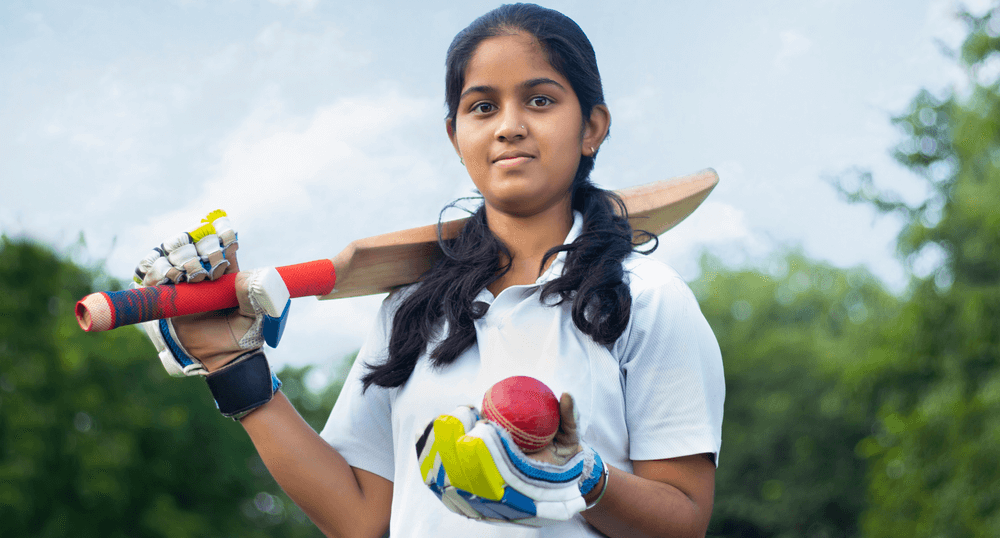 Girl playing cricket